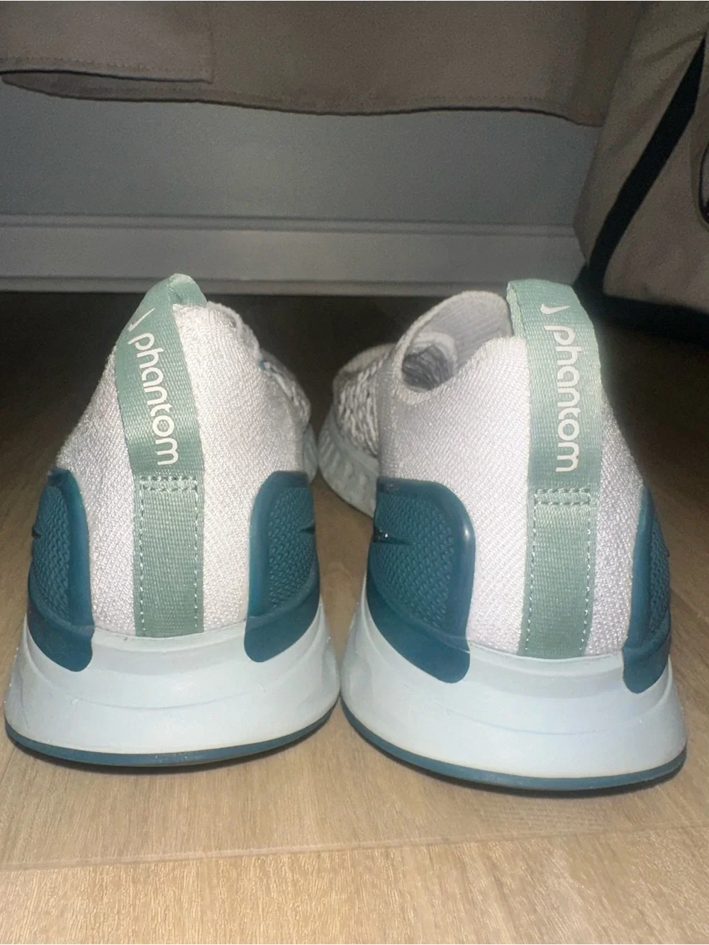 Nike Women’s White Knit Slip-On Sneakers with Teal and Gray Accents